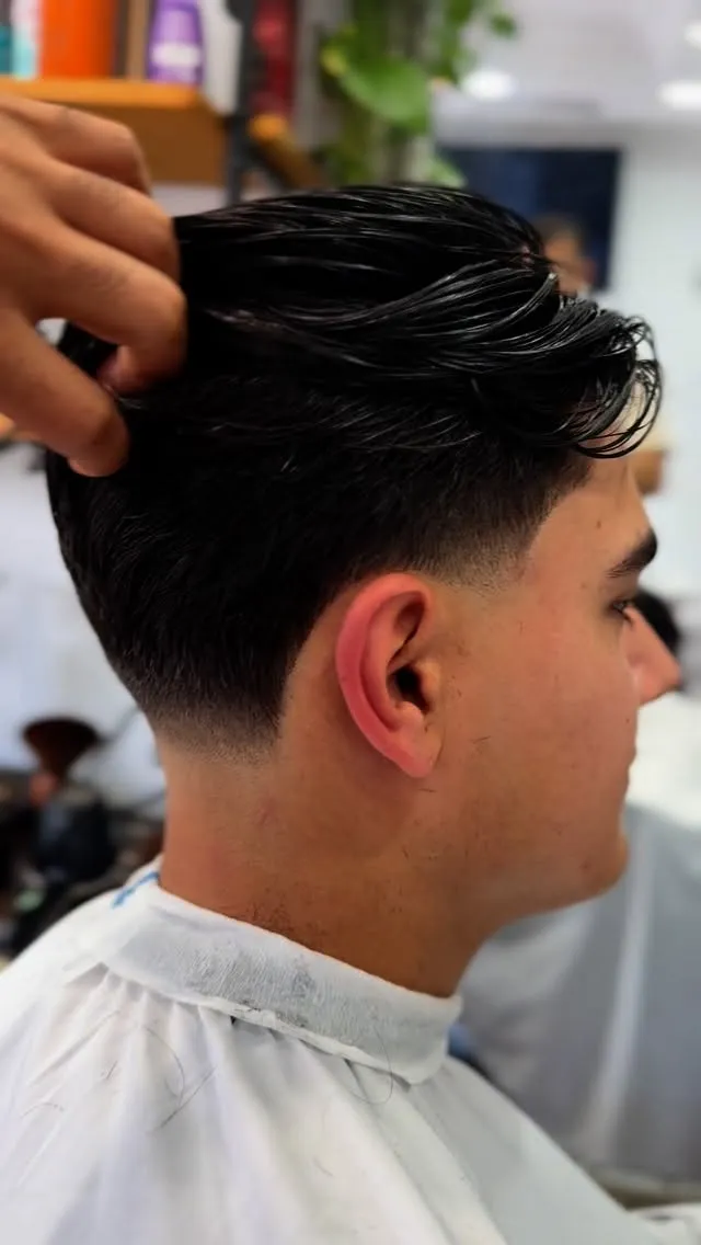 Dark textured top with a skin fade